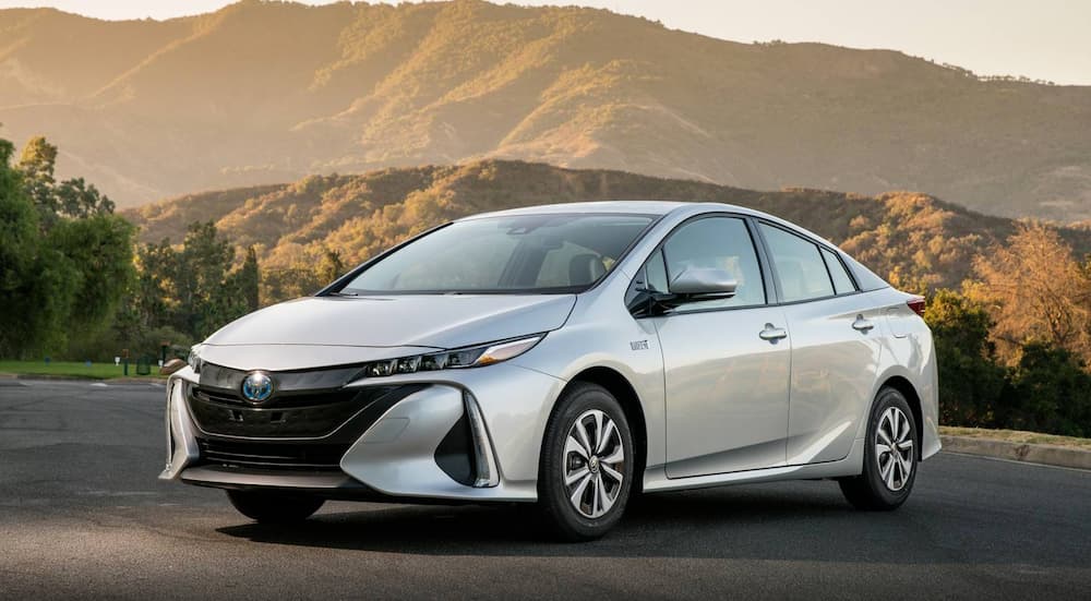 A silver 2017 Toyota Prius Premium is shown parked near a park.