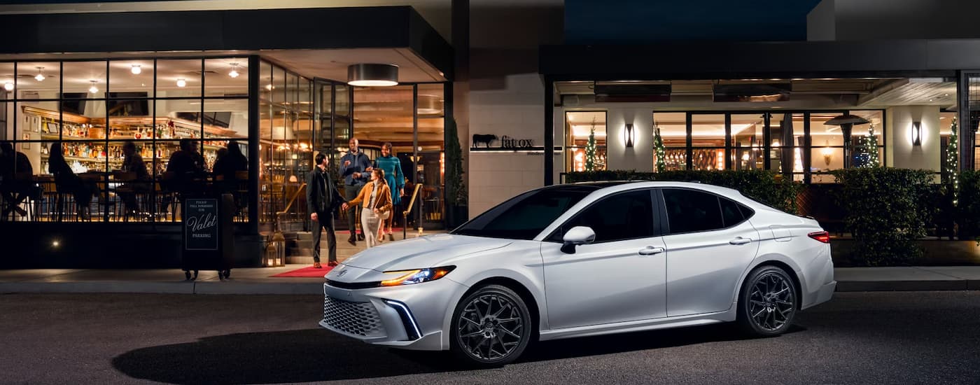 White 2025 Toyota Camry parked at night