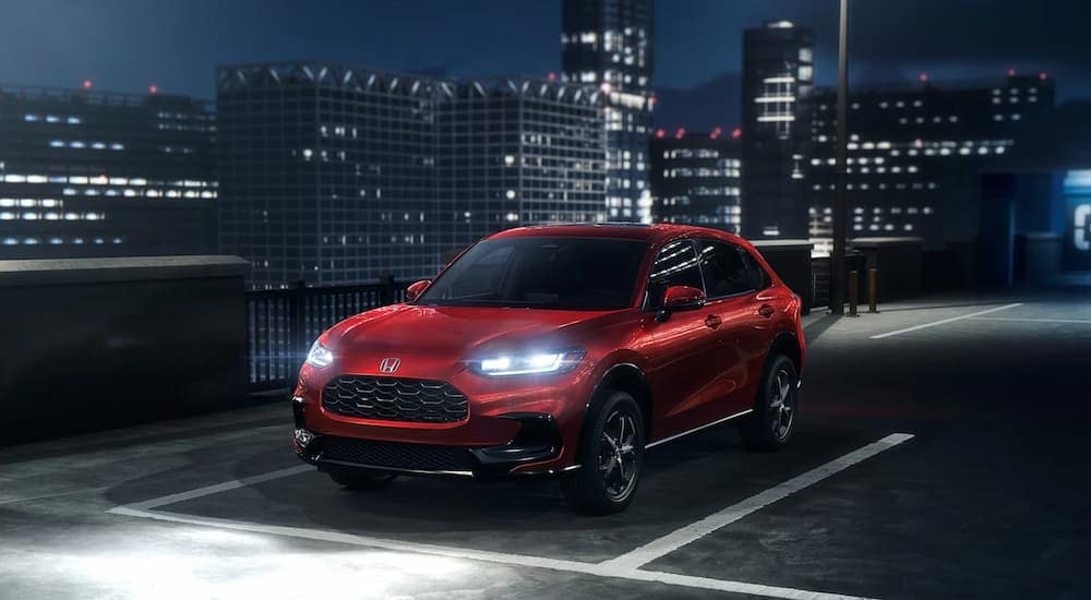 Red 2026 Honda HR-V EX-L parked on a parking lot after visiting car dealership near Atlanta.