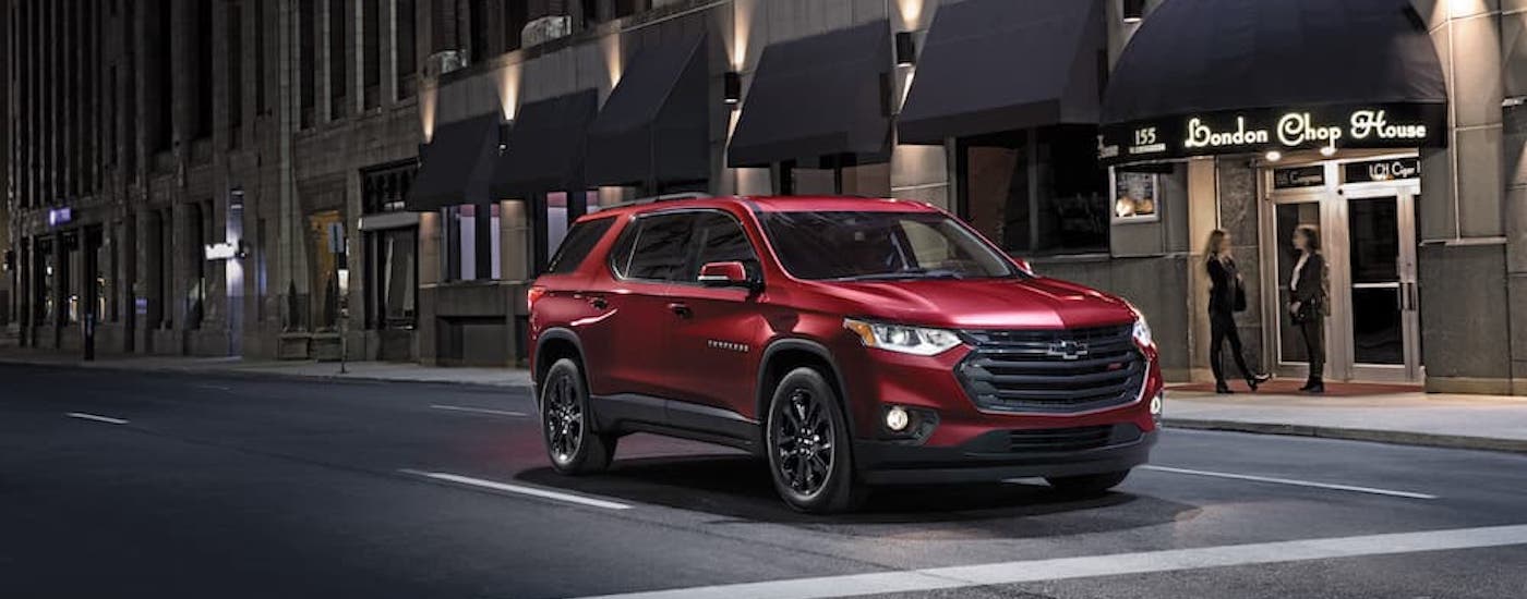 A red 2021 Chevy Traverse is shown from the front.