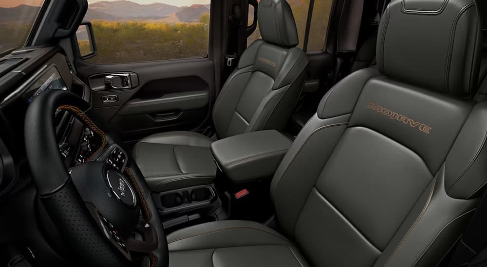 Front seats and steering wheel in a 2025 Jeep Gladiator Mojave