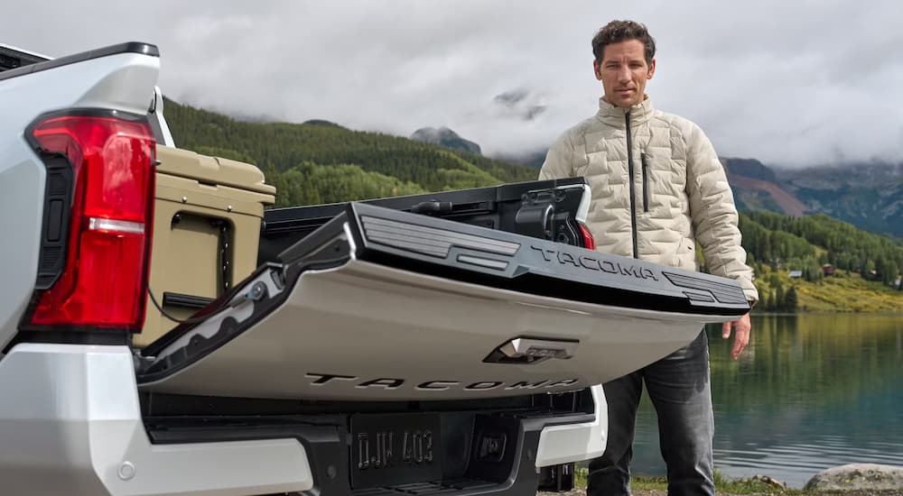 Lift gate on the bed of a white 2025 Toyota Tacoma being opened