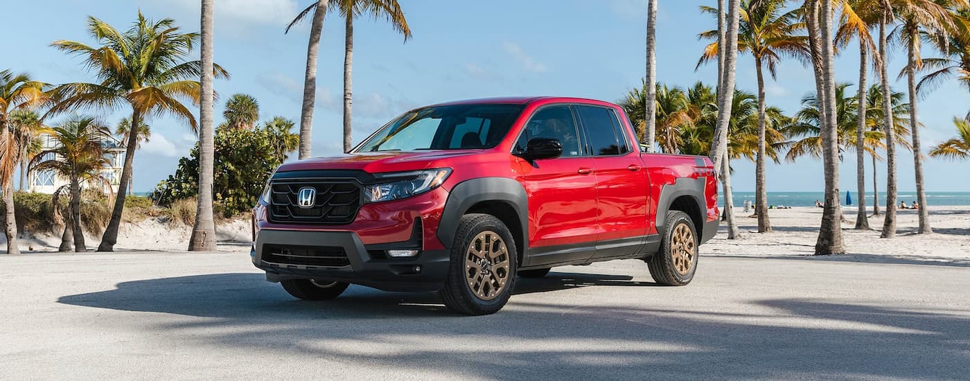 A red 2024 Honda Ridgeline from the front.